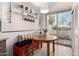 Cozy breakfast nook with seating, shelving, and sliding glass door to the outdoor patio at 2537 N Miller Rd, Scottsdale, AZ 85257