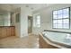 Bathroom featuring a tub with tile surround and a separate shower at 2868 E Clifton Ct, Gilbert, AZ 85295