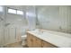 Bathroom with white cabinets, walk-in tub, and large vanity mirror at 2868 E Clifton Ct, Gilbert, AZ 85295