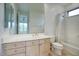 This bathroom features a neutral vanity, large mirror, and shower-tub combo at 2868 E Clifton Ct, Gilbert, AZ 85295