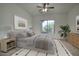 Bedroom with a large window, soft grey colors, and a patterned rug at 2868 E Clifton Ct, Gilbert, AZ 85295