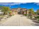 Grand two-story home featuring manicured landscaping, a sprawling driveway, and a symmetrical facade at 2868 E Clifton Ct, Gilbert, AZ 85295