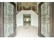 Elegant foyer showcasing a chandelier, tile flooring, and a staircase with wrought iron railings at 2868 E Clifton Ct, Gilbert, AZ 85295