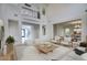 Open-concept living room featuring a high ceiling, neutral decor, and seamless flow to other living areas at 2868 E Clifton Ct, Gilbert, AZ 85295