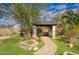 Outdoor kitchen features stone columns, granite counters and tile roof at 2868 E Clifton Ct, Gilbert, AZ 85295