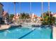 A community pool with seating areas and desert landscaping at 30 E Brown Rd # 2052, Mesa, AZ 85201