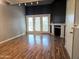 Spacious living room featuring wood floors, fireplace, and sliding doors at 30 E Brown Rd # 2052, Mesa, AZ 85201