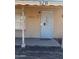 A tan brick house shows the front door with a security screen at 3211 W Bethany Home Rd, Phoenix, AZ 85017