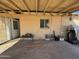 Exterior patio showcasing a covered structure and brick exterior with a view of the yard at 3211 W Bethany Home Rd, Phoenix, AZ 85017