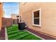 Low-maintenance backyard with artificial turf, perfect for relaxation and outdoor enjoyment at 3507 E Erie St, Gilbert, AZ 85295