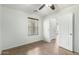 Bedroom featuring tile floors, a ceiling fan, and a view into the hallway at 3507 E Erie St, Gilbert, AZ 85295