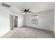 Bedroom featuring carpet, natural light, a ceiling fan and ensuite bathroom at 3507 E Erie St, Gilbert, AZ 85295