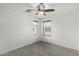 Bedroom boasting neutral carpet, natural light, and a ceiling fan for comfort at 3507 E Erie St, Gilbert, AZ 85295