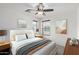 Relaxing bedroom featuring a ceiling fan, coordinated decor and bedside tables at 3507 E Erie St, Gilbert, AZ 85295