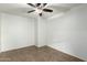 Neutral bedroom with tile floors, ceiling fan, and ample natural light at 3507 E Erie St, Gilbert, AZ 85295