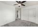 Bedroom featuring neutral carpet, a ceiling fan, and a closet space at 3507 E Erie St, Gilbert, AZ 85295