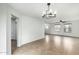 Living room featuring neutral walls, tile flooring, and a modern chandelier at 3507 E Erie St, Gilbert, AZ 85295