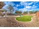 Lush backyard with well-manicured lawn and inviting pool area at 3542 E Pala Ct, Gilbert, AZ 85297