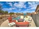 Lush backyard featuring a fire pit, pool, and cozy lounge area at 3542 E Pala Ct, Gilbert, AZ 85297