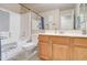 Bathroom featuring shower over tub and light wood vanity at 3542 E Pala Ct, Gilbert, AZ 85297