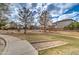 Community park featuring mature shade trees, grassy areas, playground, and sidewalks for pedestrian access at 3542 E Pala Ct, Gilbert, AZ 85297