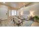 Inviting living room featuring plantation shutters, neutral colors, and comfortable seating at 3542 E Pala Ct, Gilbert, AZ 85297