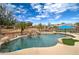 Gorgeous pool and water feature with lush landscaping in private backyard at 3542 E Pala Ct, Gilbert, AZ 85297