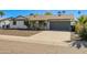 Charming single-story home with a two-car garage and extended driveway at 3619 E Friess Dr, Phoenix, AZ 85032