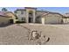 Two-story home with low-maintenance desert landscaping in front yard at 493 E Baylor Ln, Gilbert, AZ 85296