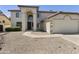 Inviting two-story home featuring a two-car garage and low-maintenance desert landscaping at 493 E Baylor Ln, Gilbert, AZ 85296