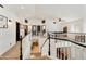 Bright upper hallway with view to below and carpeted floors at 493 E Baylor Ln, Gilbert, AZ 85296