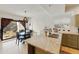 Kitchen with granite counters and island, sage green cabinets and stainless steel sink at 493 E Baylor Ln, Gilbert, AZ 85296