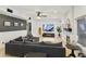 Bright living room with a decorative fireplace and large sectional sofa at 493 E Baylor Ln, Gilbert, AZ 85296