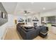 Open concept living room, complete with a fireplace, and a large sectional sofa at 493 E Baylor Ln, Gilbert, AZ 85296