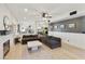 Open-concept living room featuring a decorative fireplace and modern furnishings at 493 E Baylor Ln, Gilbert, AZ 85296