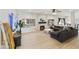 Spacious living room featuring a decorative fireplace and comfortable sectional sofa at 493 E Baylor Ln, Gilbert, AZ 85296