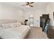 Large primary bedroom with neutral color palette, carpet floors, and doorway to ensuite bath at 493 E Baylor Ln, Gilbert, AZ 85296