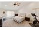 Spacious main bedroom featuring neutral tones, carpet floors and ceiling fan at 493 E Baylor Ln, Gilbert, AZ 85296