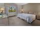 Cozy bedroom featuring neutral tones, carpet flooring, and a window with natural light at 5254 E Arroyo Rd, Paradise Valley, AZ 85253