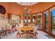 Charming dining room with a chandelier, views and french doors leading to the outdoor patio at 5254 E Arroyo Rd, Paradise Valley, AZ 85253