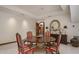 Traditional dining room featuring a wood table, striped chairs, and decorative accents at 5254 E Arroyo Rd, Paradise Valley, AZ 85253