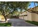 Three-car garage surrounded by greenery, offering ample parking and storage at 5254 E Arroyo Rd, Paradise Valley, AZ 85253