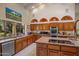 Bright kitchen featuring granite countertops, stainless steel appliances, and custom cabinetry at 5254 E Arroyo Rd, Paradise Valley, AZ 85253