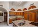 Open kitchen area features a large island, custom cabinetry, and plenty of counter space at 5254 E Arroyo Rd, Paradise Valley, AZ 85253