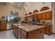 Gourmet kitchen with a large island, stainless steel appliances, and custom wood cabinetry at 5254 E Arroyo Rd, Paradise Valley, AZ 85253