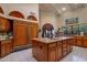 Spacious kitchen island with granite countertops, custom cabinetry, and modern appliances at 5254 E Arroyo Rd, Paradise Valley, AZ 85253