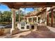 Outdoor kitchen with a built-in grill, counter space, and tile accents, perfect for entertaining at 5254 E Arroyo Rd, Paradise Valley, AZ 85253