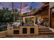 Outdoor kitchen with built-in grill and ample counter space, great for outdoor gatherings with sunset views at 5254 E Arroyo Rd, Paradise Valley, AZ 85253