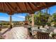 Inviting outdoor patio with a fireplace, seating area, and lush landscaping offering picturesque views at 5254 E Arroyo Rd, Paradise Valley, AZ 85253