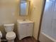 Bathroom featuring a toilet, sink, vanity, tub and a shower with a curtain at 549 E Mckellips Rd # 55, Mesa, AZ 85203